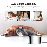 Pet drinking from fountain with sleek design