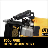 Pin nailer driving 23-gauge pin into wood trim