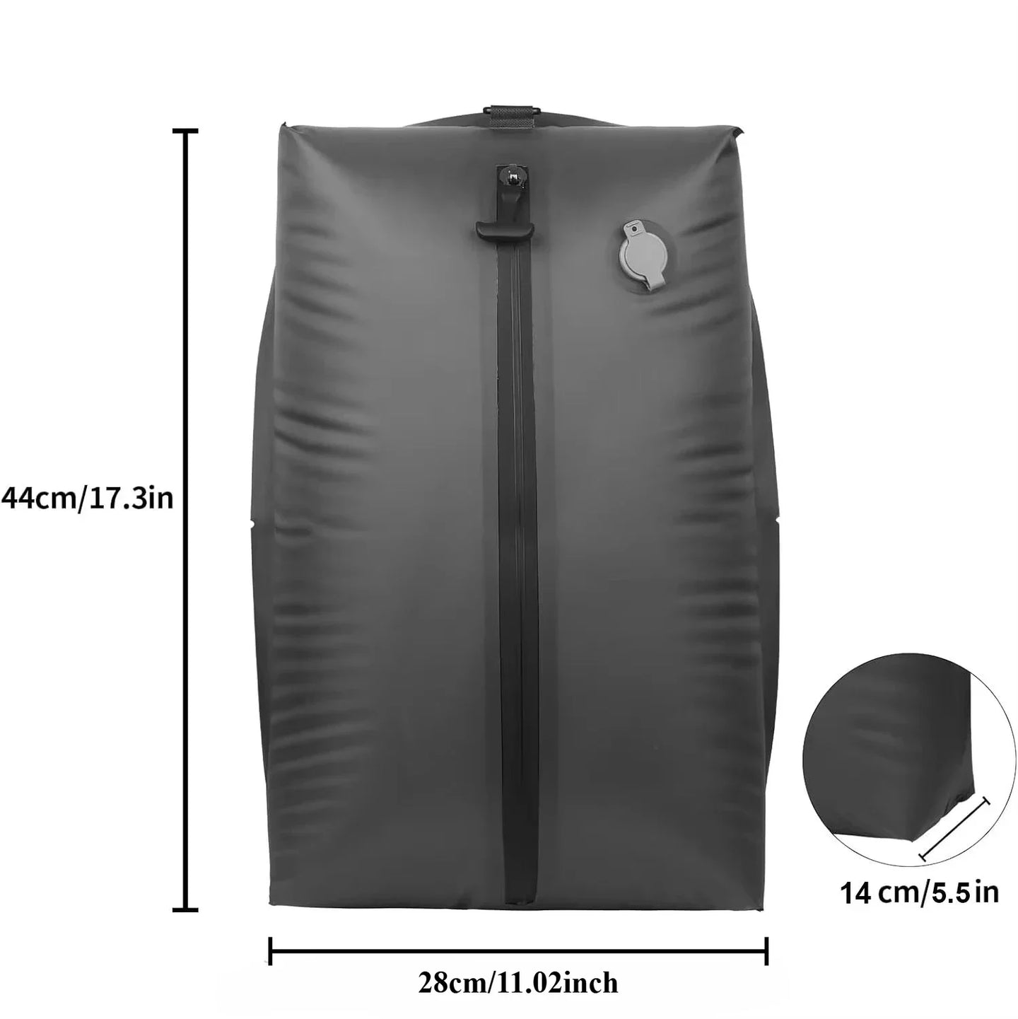 Vacuum compression bag filled with clothes on suitcase